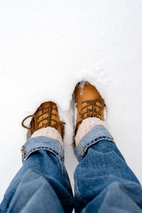 Boots in the snow, top view.