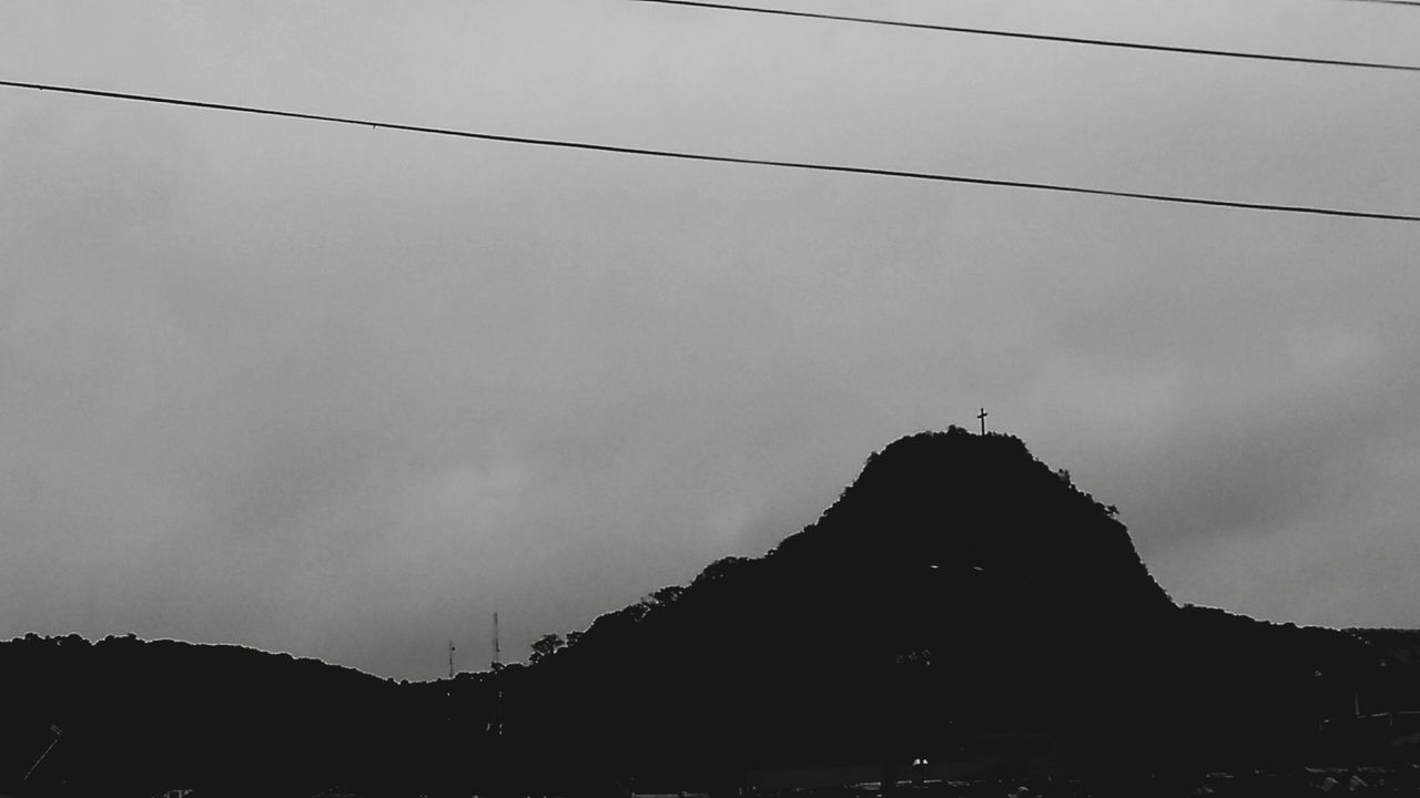 architecture, built structure, sky, building exterior, low angle view, silhouette, mountain, religion, place of worship, cloud - sky, dusk, spirituality, outdoors, history, nature, travel destinations, cloud, famous place, no people, sunset