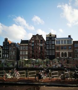 Bicycles on street against buildings in city