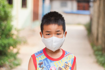 Portrait of boy standing outdoors