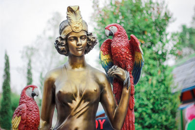 Brass statue of woman.