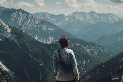 Rear view of woman looking at mountains