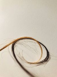 High angle view of eyeglasses on table against white background