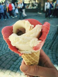 Close-up of hand holding ice cream