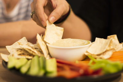 Close-up of person preparing food