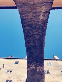 Low angle view of building against blue sky