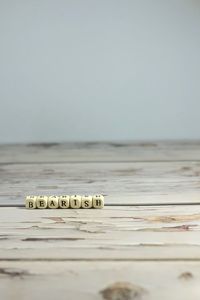 Surface level of table by sea against clear sky