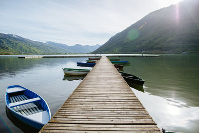 Pier over lake against sky