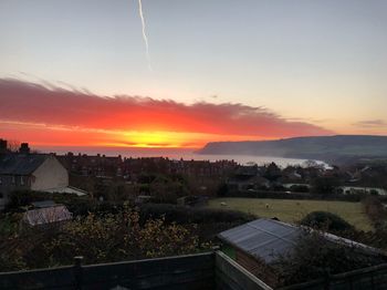 High angle view of townscape against sky during sunset