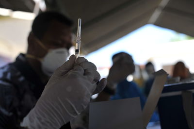 Close-up of people working