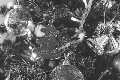 Close-up of christmas decorations hanging on tree