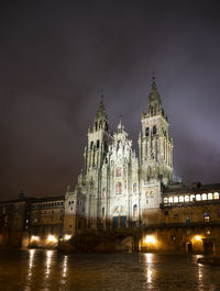 Illuminated building against sky at night