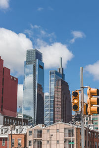 Low angle view of buildings against blue sky