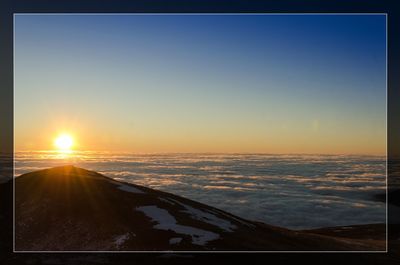 Scenic view of sea against clear sky during sunset