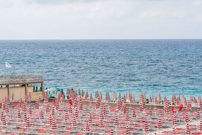 High angle view of townscape by sea against sky