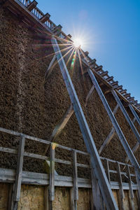 Low angle view of metallic structure against sky