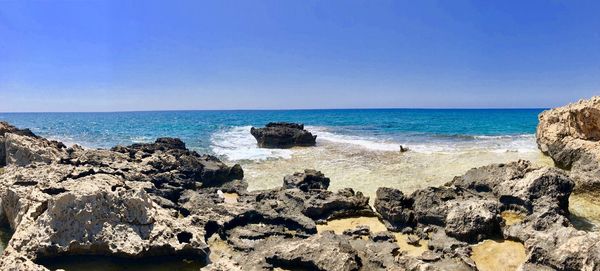 Scenic view of sea against clear sky