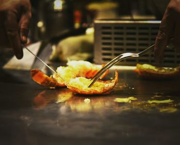 Close-up of man preparing food