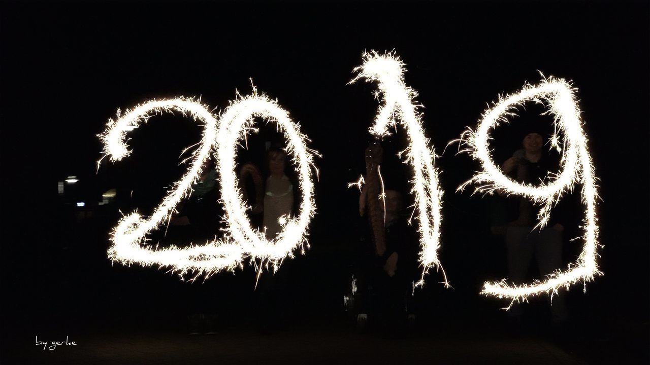 illuminated, night, glowing, motion, arts culture and entertainment, long exposure, celebration, event, nature, text, positive emotion, real people, communication, firework, outdoors, emotion, sky, firework display, firework - man made object