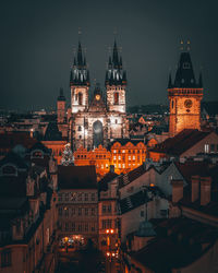 Illuminated buildings in city at night