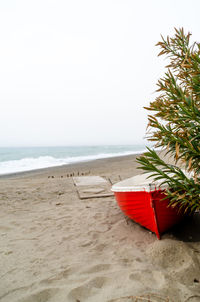 Scenic view of beach against clear sky