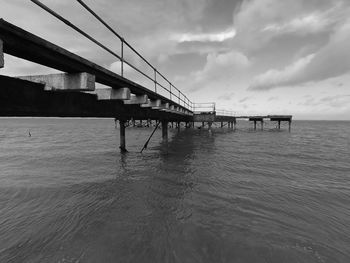 Pier over sea against sky