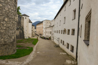 Footpath amidst buildings in town