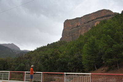 Scenic view of mountain against cloudy sky