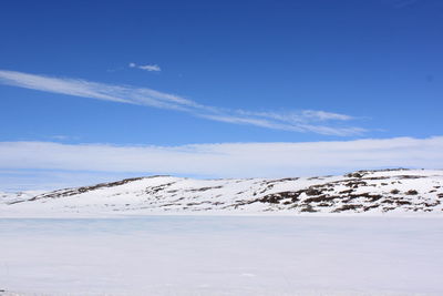 Landscape with snow-capped mountains - hardangervidda