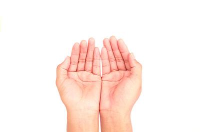 Close-up of hand over white background