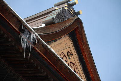 Low angle view of built structure against clear blue sky