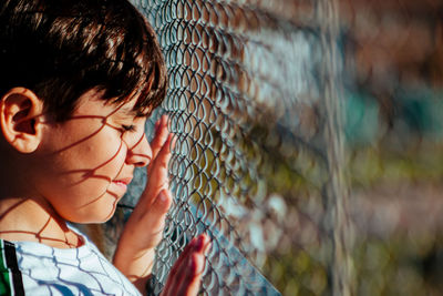 Close-up portrait of boy looking away