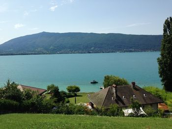 Scenic view of sea and buildings against sky