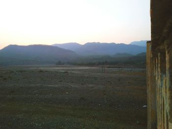 Scenic view of field against clear sky