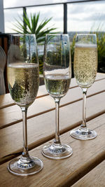 Close-up of wine glasses on table