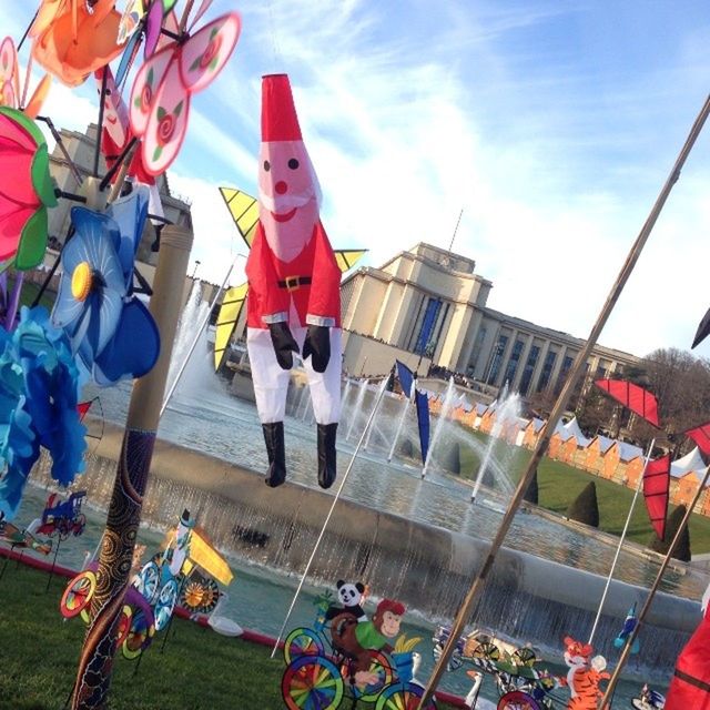 hanging, multi colored, leisure activity, childhood, large group of people, lifestyles, protection, flag, day, fun, outdoors, large group of objects, men, enjoyment, safety, variation, padlock, sky, patriotism