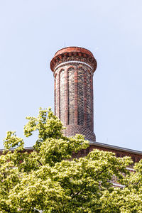 Low angle view of historical tower against clear sky