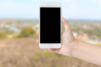 Close-up of hand holding smart phone