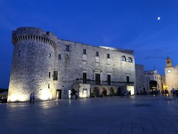 Buildings in city at night