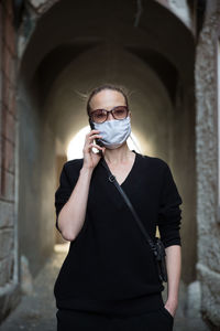 Portrait of man wearing sunglasses standing outdoors