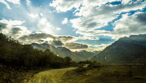 Scenic view of landscape and mountains against sky