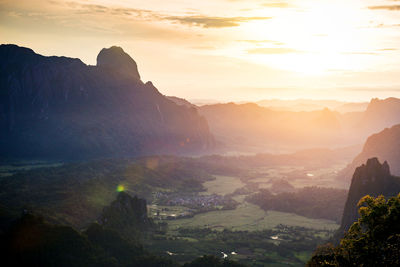 Scenic view of mountains against sky during sunset