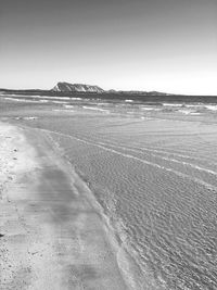 Scenic view of beach against clear sky
