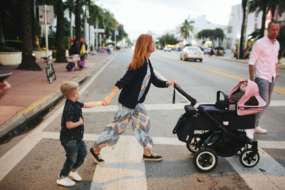 Mother with children crossing road