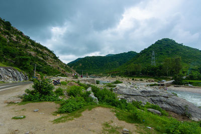 Scenic view of landscape and mountains against sky