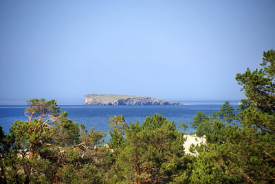 Scenic view of sea against clear blue sky