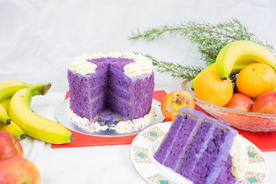 Close-up of cake and fruits on table during christmas