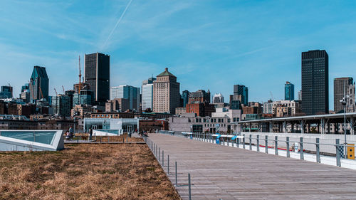 Modern buildings in city against sky