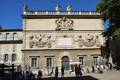 Group of people in front of historical building