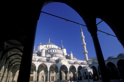 Low angle view of building against blue sky